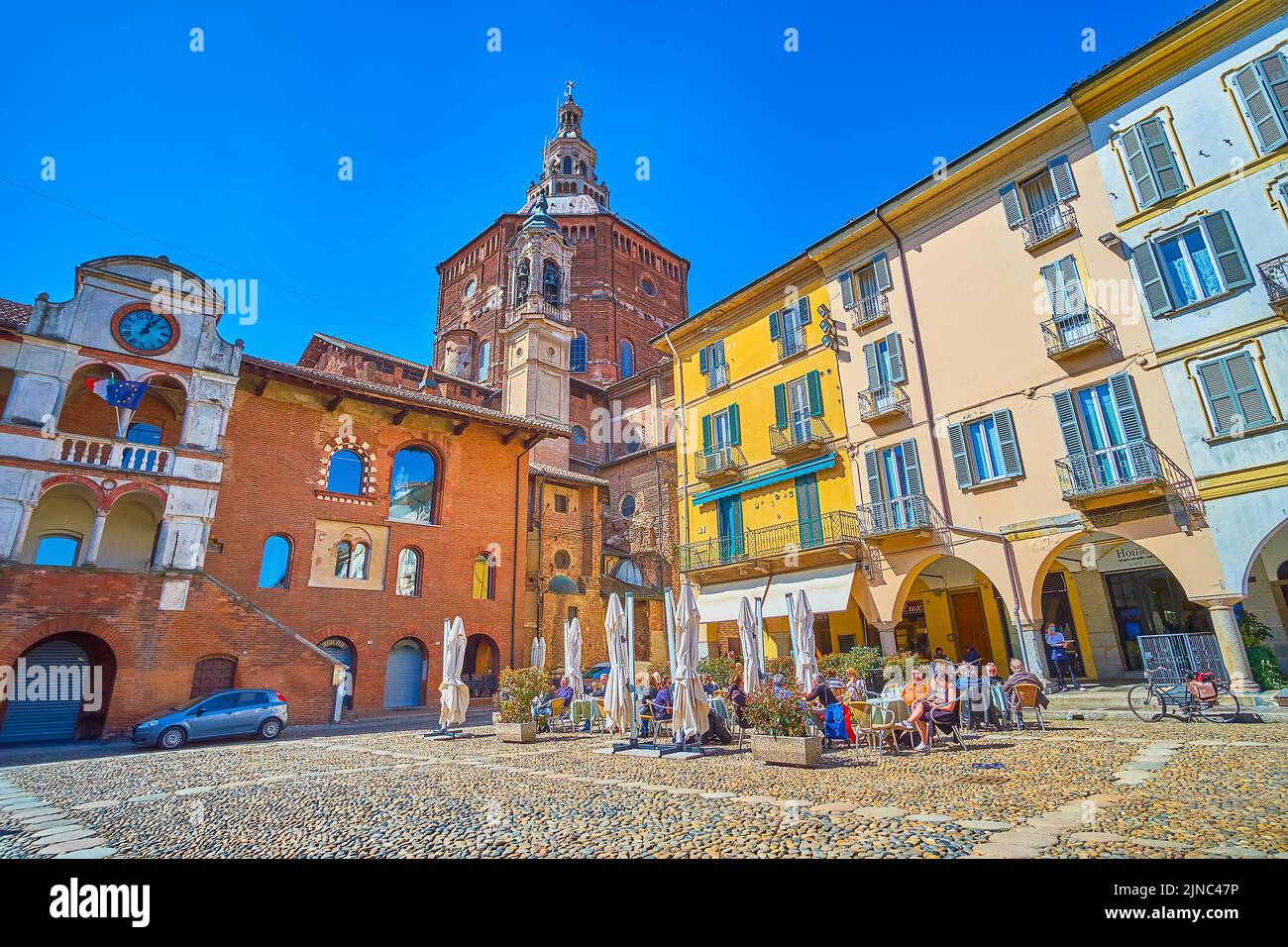 PAVIA, ITALY - APRIL 9, 2022: The heart of Pavia old town, Piazza della Vittorio  with medieval palaces and villas, on April 9 in Pavia, Italy Stock Photo
