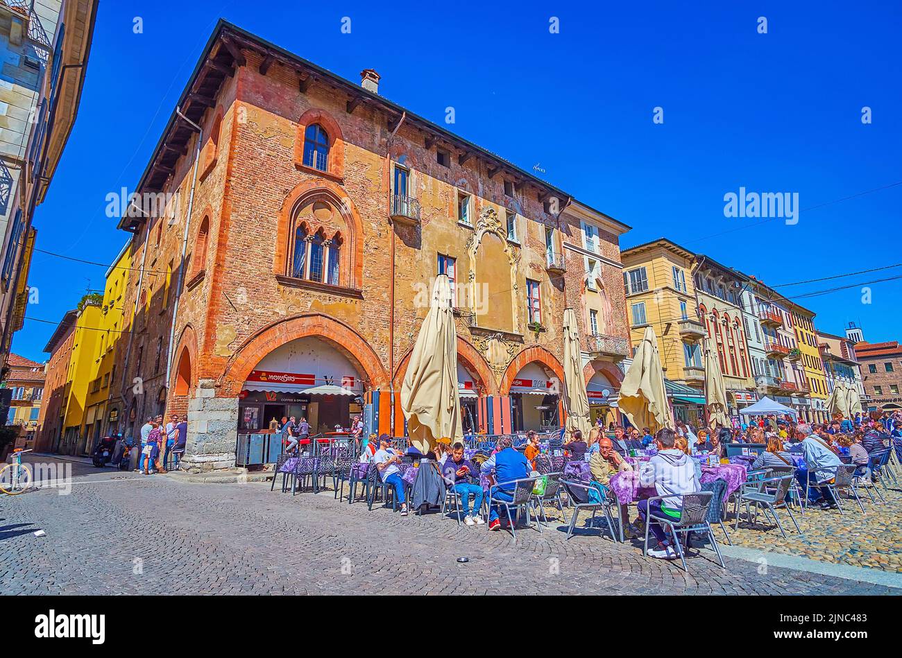 PAVIA, ITALY - APRIL 9, 2022: Palazzo dei Diversi is one of the most notable landmarks on Piazza della Vittorio and occupied with local restaurant,, o Stock Photo