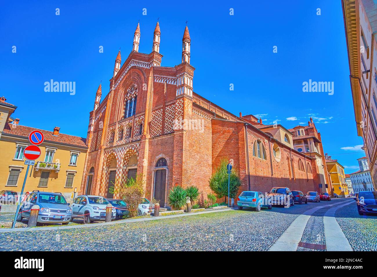 PAVIA, ITALY - APRIL 9, 2022: The  great contrast facade of medieval Church of San Francesco Maggiore, on April 9 in Pavia, Italy Stock Photo