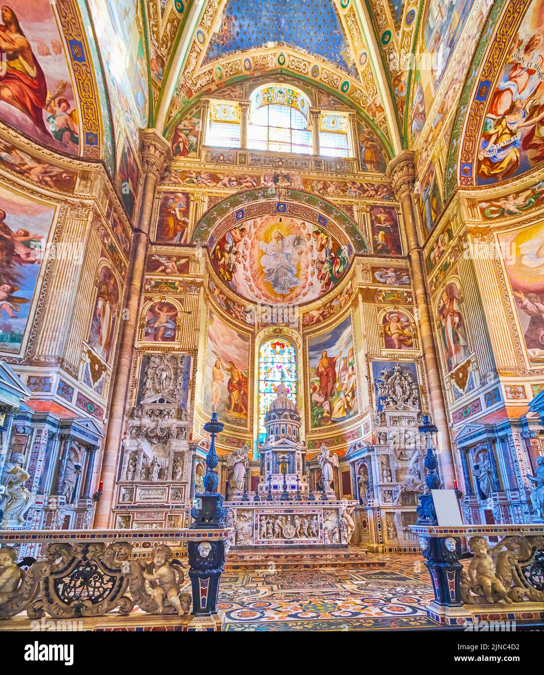 CERTOSA DI PAVIA, ITALY - APRIL 9, 2022: The outstanding painted walls and the high Altar of Certosa di Pavia monastery, on April 9 in Certosa di Pavi Stock Photo