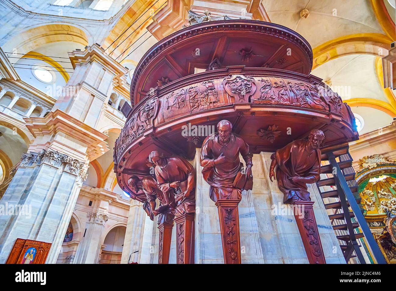 PAVIA, ITALY - APRIL 9, 2022: The wooden carved pulpit in Cathedral od Pavia made by sculptor Siro Zanella, on April 9 in Pavia, Italy Stock Photo