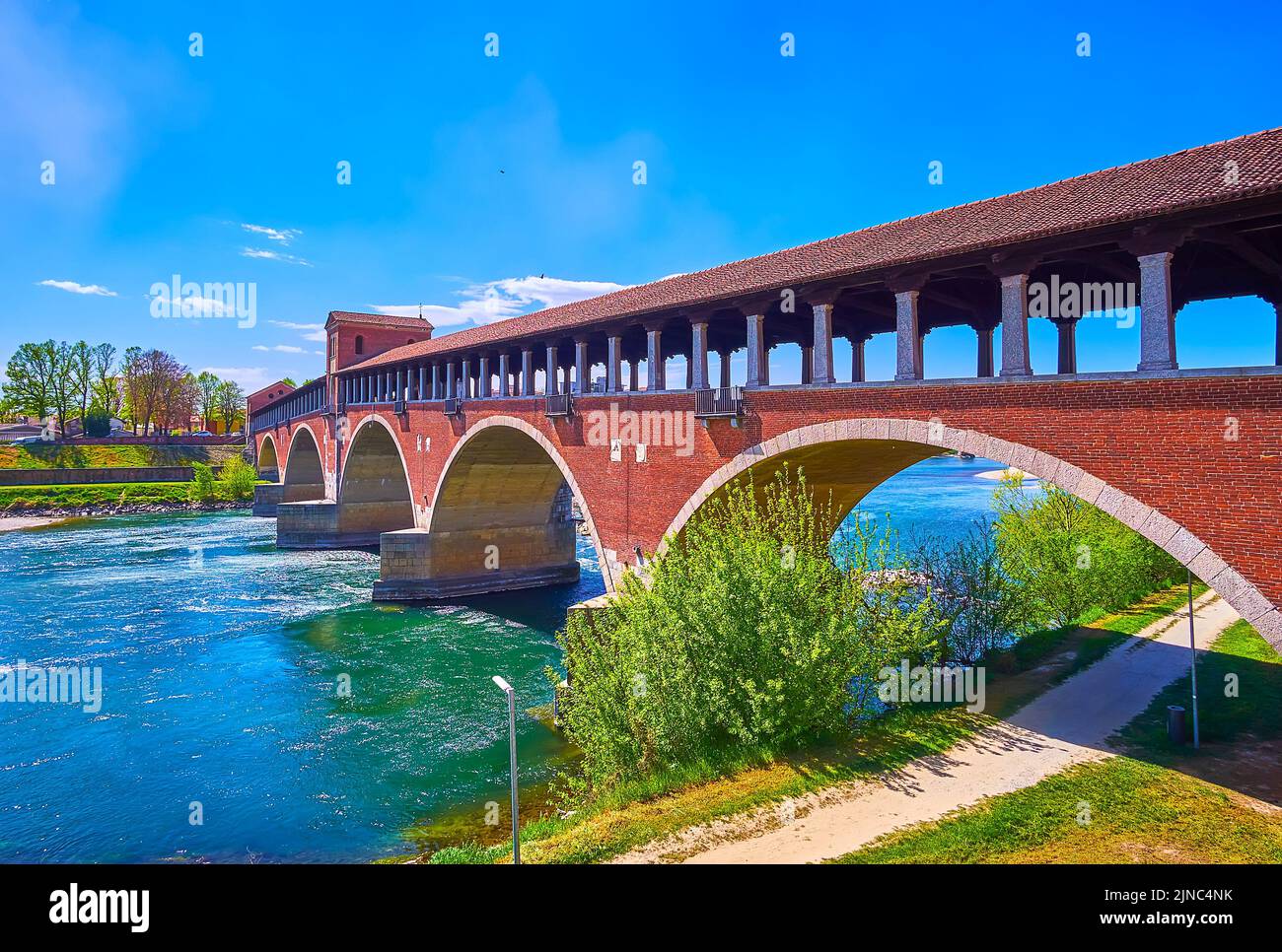Ponte Coperto brick bridge over Ticino River in Pavia, Italy Stock Photo