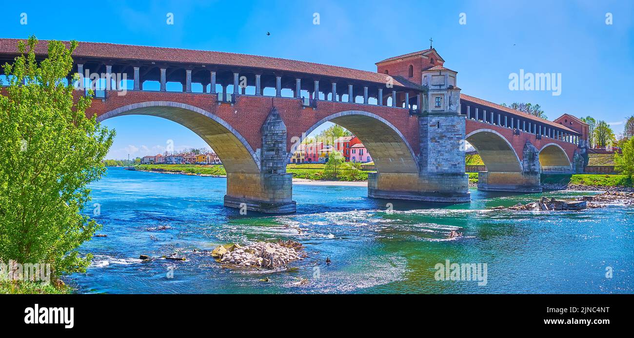 Panoramic view on reconstructed Ponte Coperto bridge across Ticino river in Pavia city, Italy Stock Photo