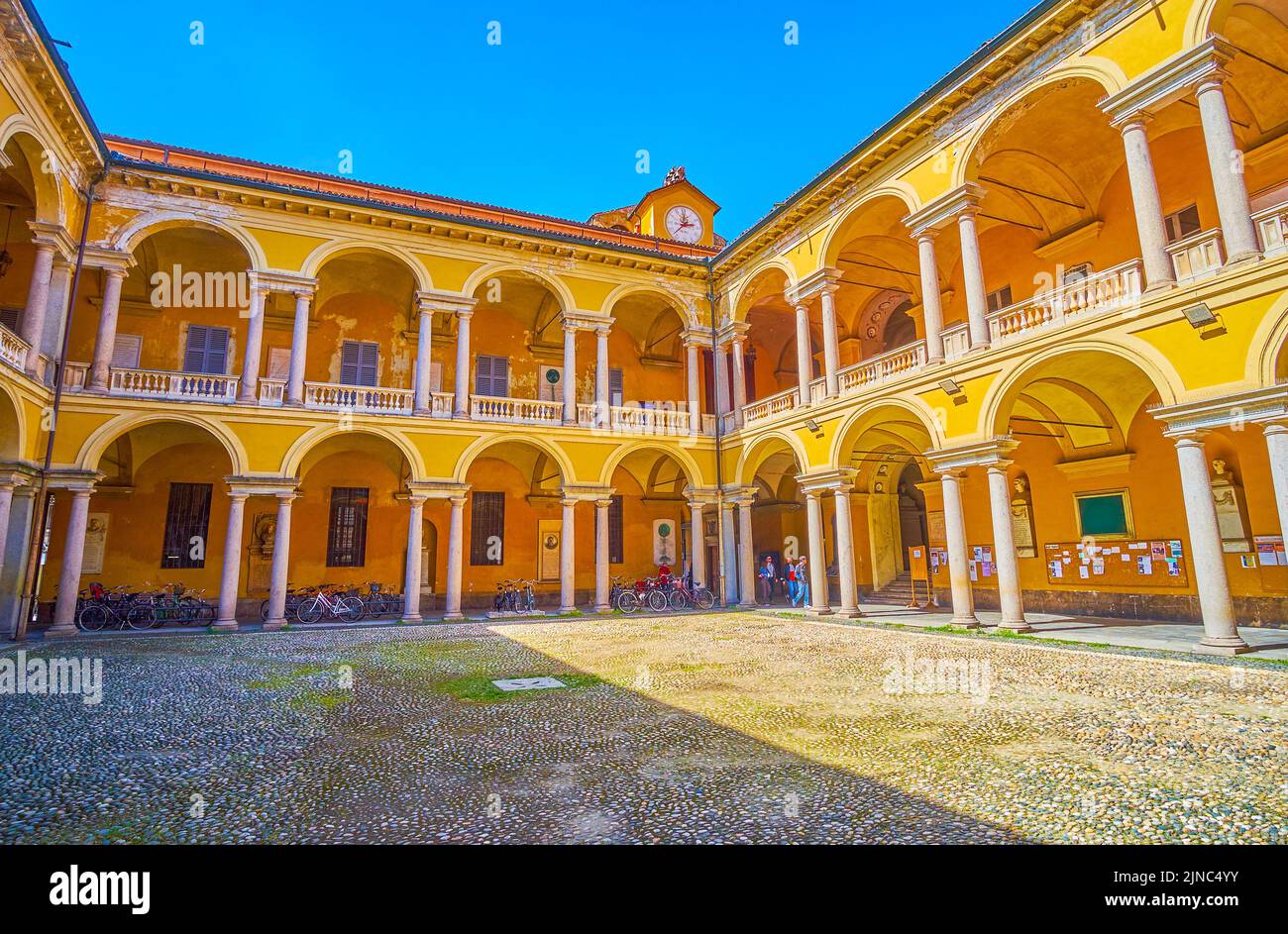 PAVIA, ITALY - APRIL 9, 2022: One of the courtyards of University of Pavia, decorated with colonnades, on April 9 in Pavia, Italy Stock Photo