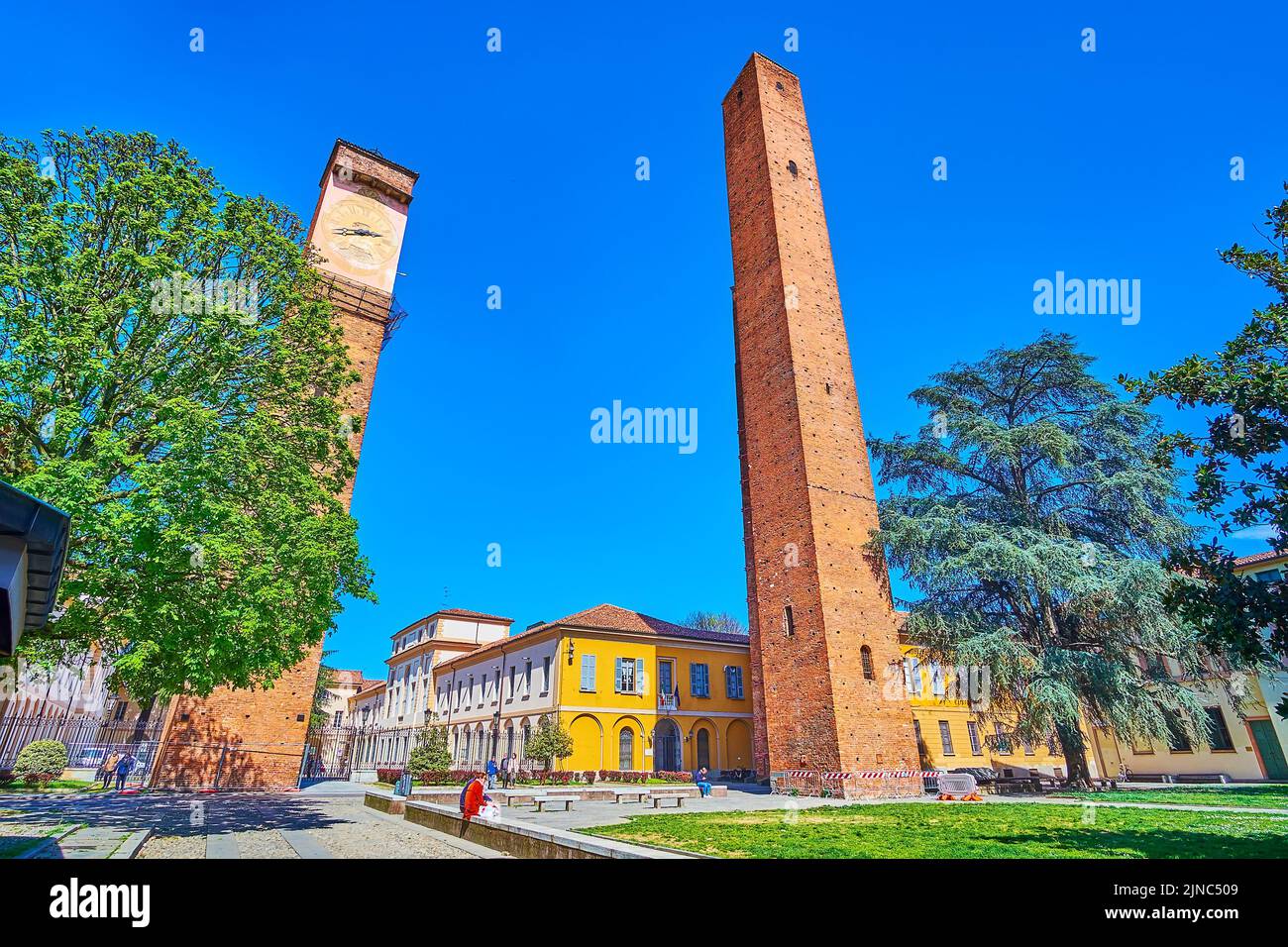 PAVIA, ITALY - APRIL 9, 2022: The most significant landmarks of historic Pavia are the the medieval towers, concentrated on Piazza Leonardo da Vinci, Stock Photo