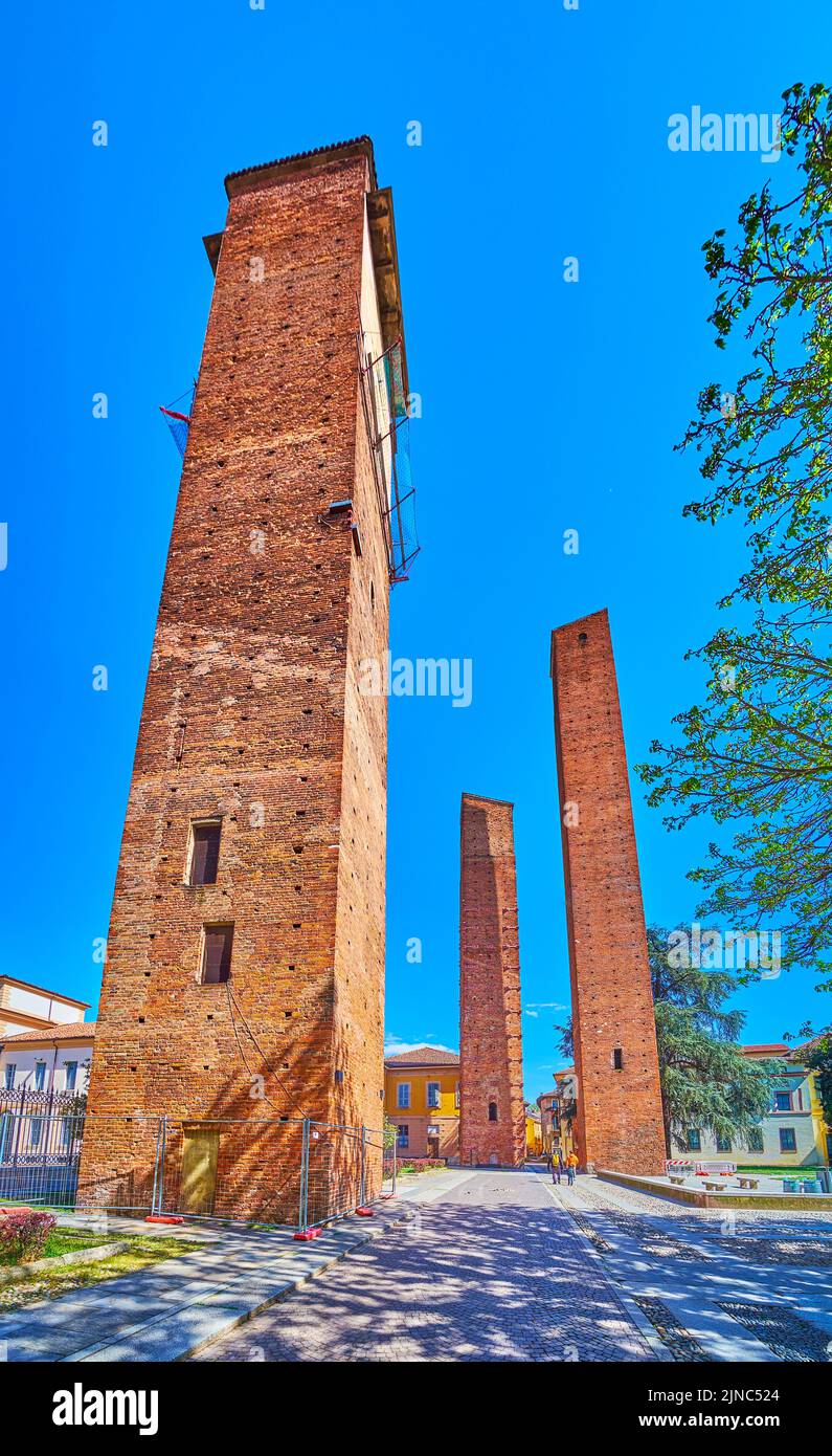 Three preserved medieval towers on Piazza Leonardo da Vinci in Pavia, Italy Stock Photo