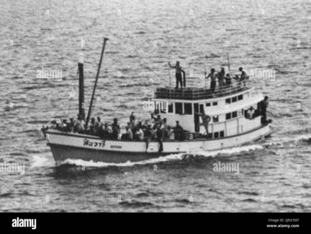 Thai fishing boat with the crew of the seized SS Mayaguez underway on 15 May 1975 Stock Photo