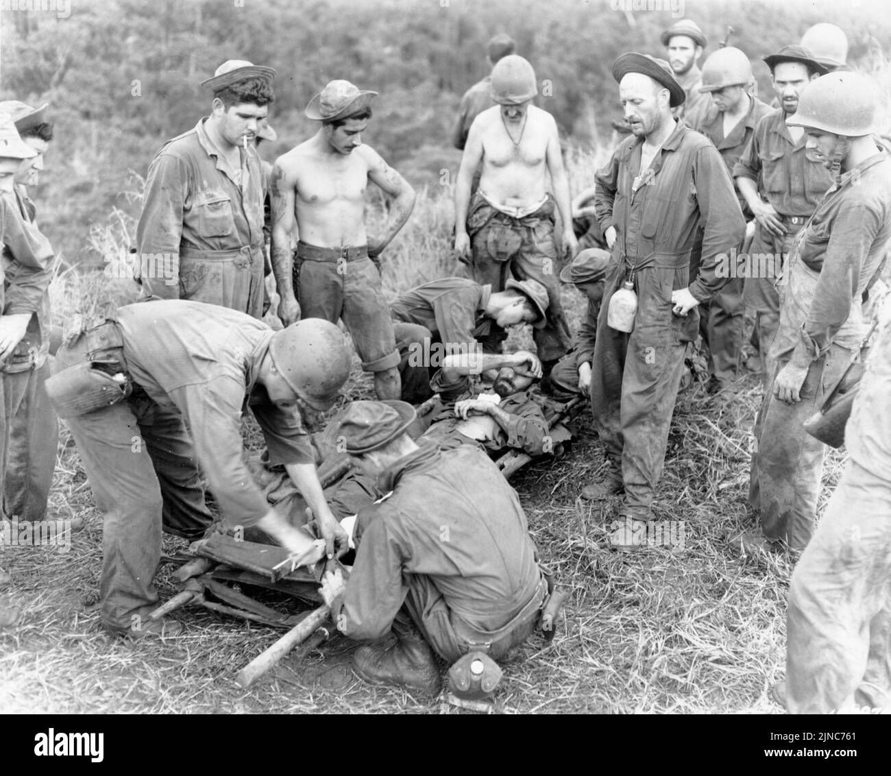 As wounded US Marine being prepared for evacuation during the Battle of Battle of Mount Austen on Guadalcanal during WW2 Stock Photo