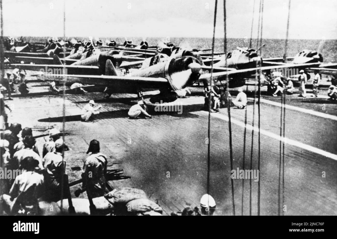 Japanese fighter and dive bomber aircraft on Shōkaku prepare to launch for an attack on U.S. carrier forces Stock Photo