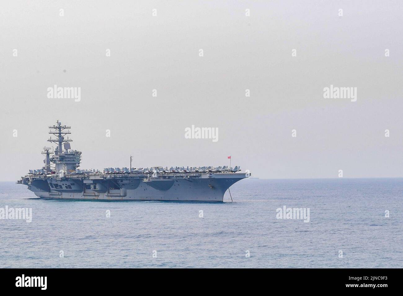 The aircraft carrier USS Nimitz (CVN 68) anchors off the coast of India