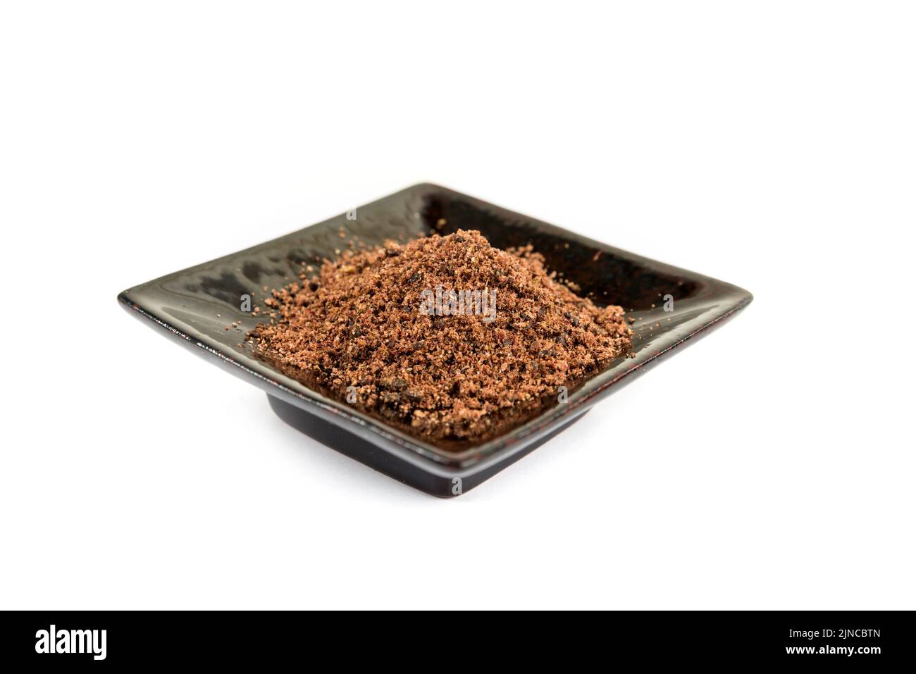 Sumac Plate Ground dried sumac berry powder on a black ceramic plate Stock Photo ...