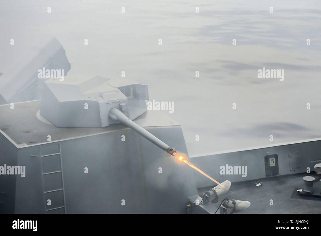 The amphibious transport dock ship USS Green Bay (LPD 20) fires a MK-46 30mm gun during a live-fire exercise (28540439144) Stock Photo