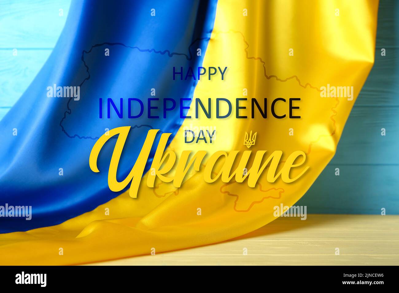 Poster for Ukrainian Independence Day with flag on wooden background Stock Photo