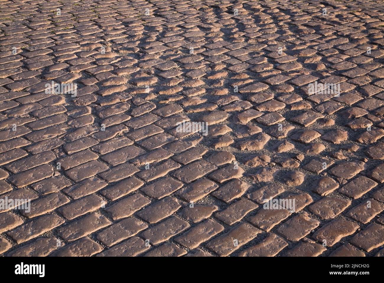 Close-up of brownish rectangular cobble style paving stones, Old Port of Montreal, Quebec, Canada Stock Photo