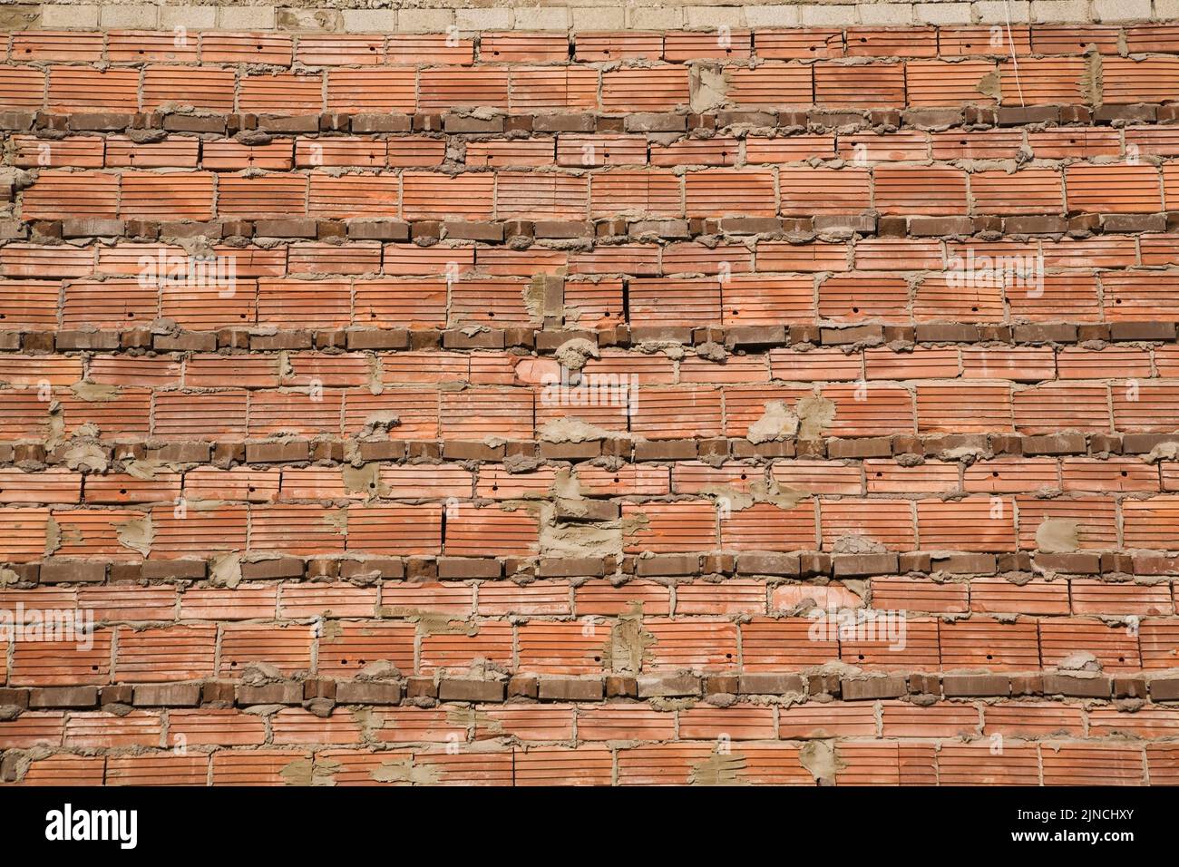 Close-up of red brick wall with exposed cement mortar joints, Quebec, Canada Stock Photo