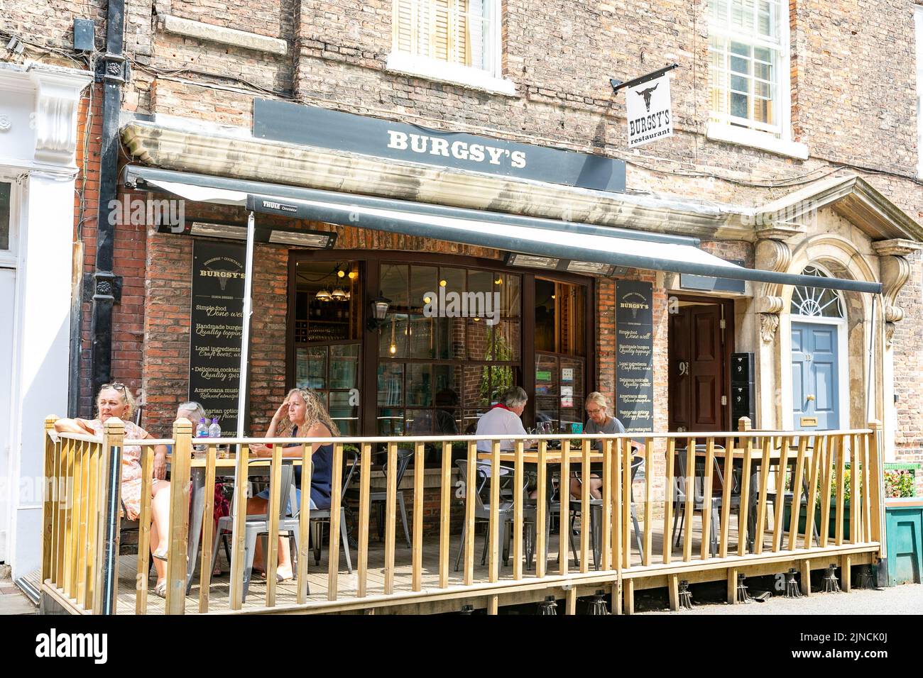 City of York, Burgsy's burger restaurant in Castlegate York, people enjoy lunch outside,Yorkshire,England,UK,summer 2022 Stock Photo