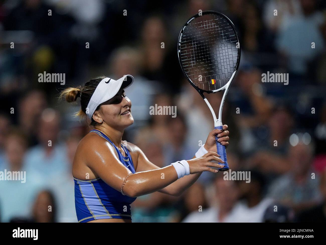 Bianca Andreescu, of Canada, reacts while playing against Alize