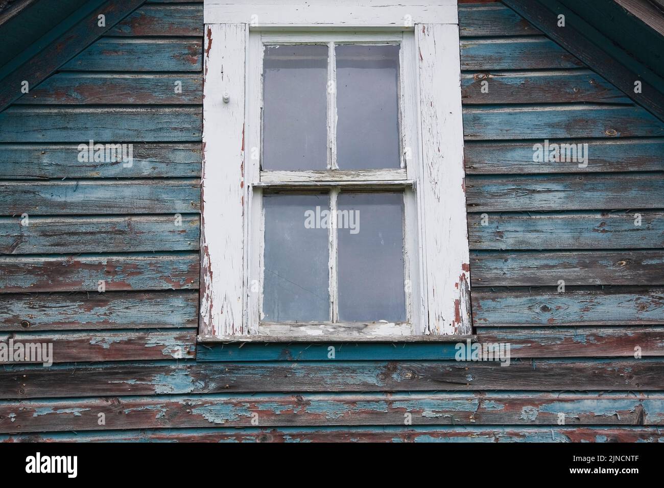 Close-up of glass pane window on old abandoned house, Quebec, Canada Stock Photo