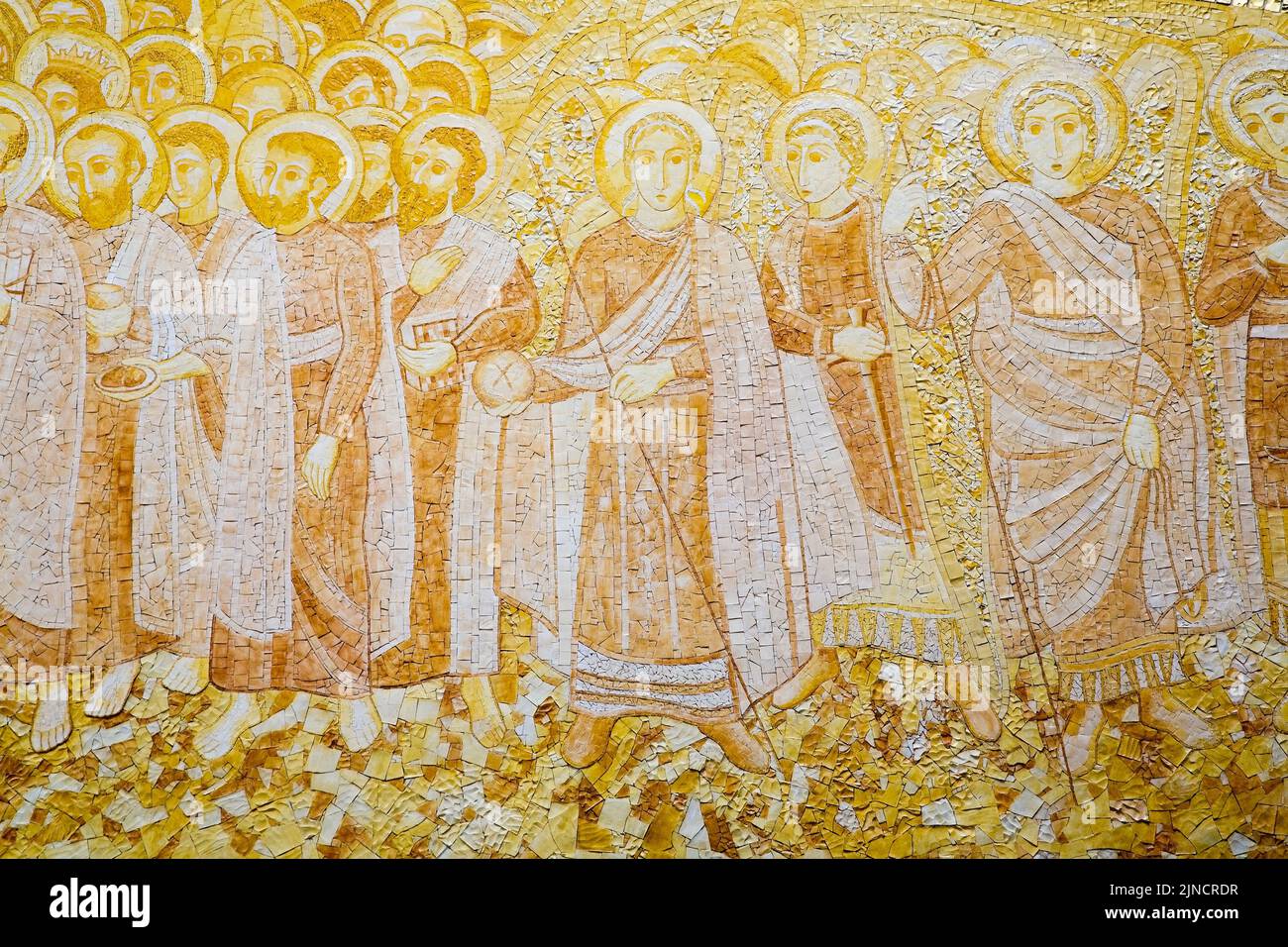Gold and white colored religious mosaic on wall inside the basilica at Fatima, Portugal Stock Photo