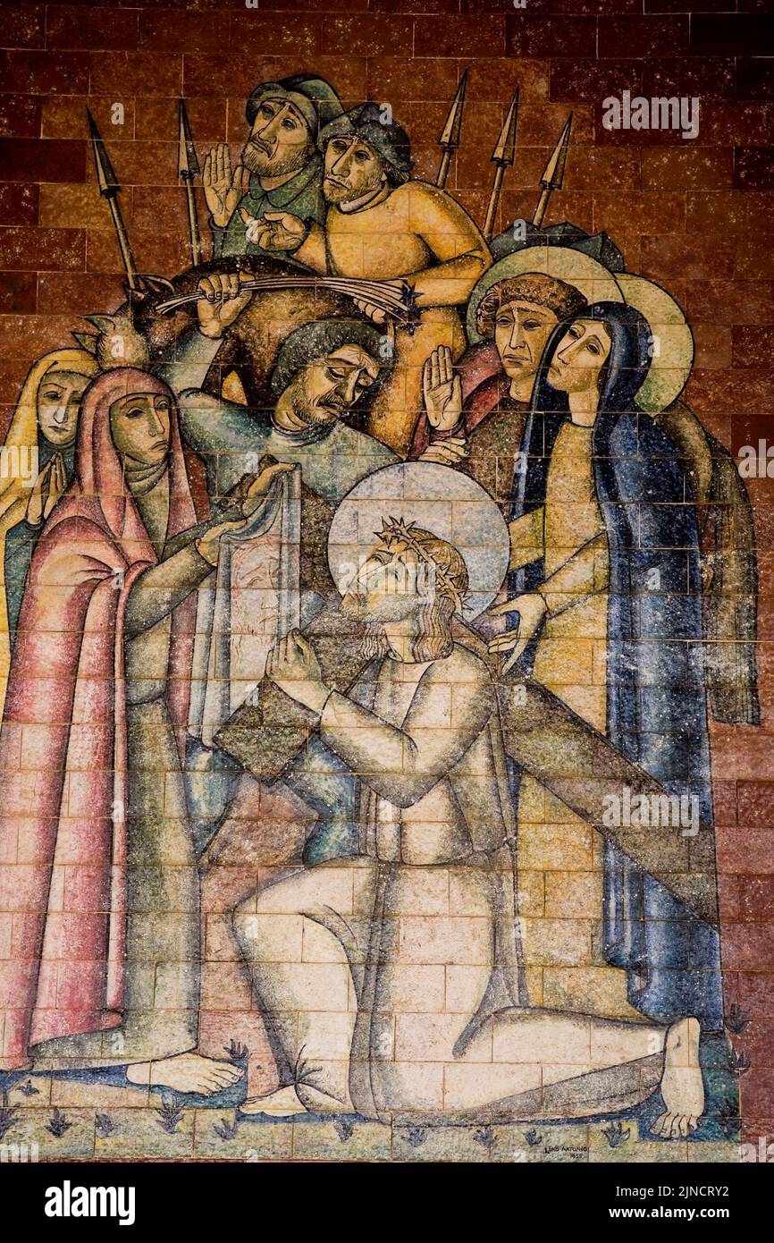 Religious scene painted on the ceramic wall tiles at the Fatima basilica, Portugal Stock Photo