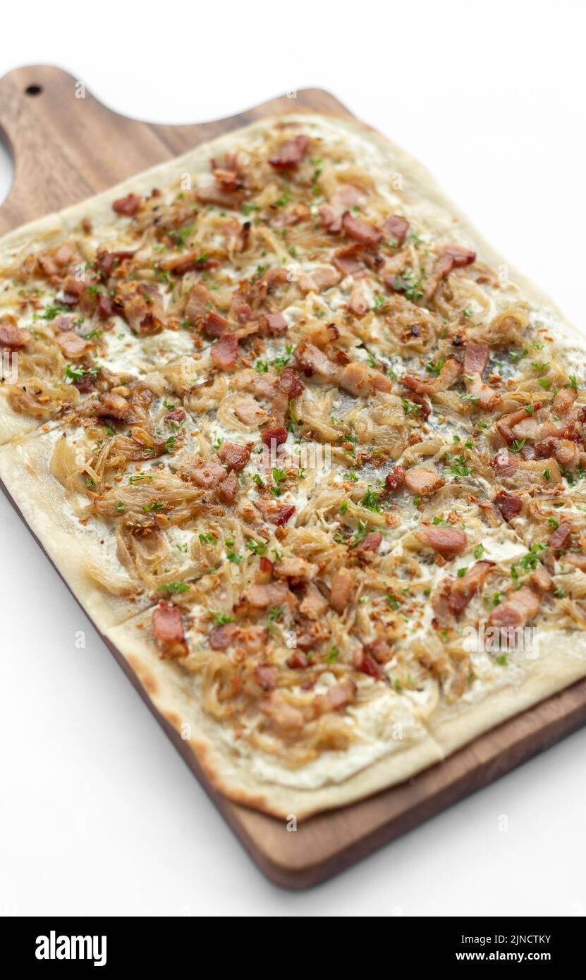 Flammkuchen tarte flambee rectangular pizza with bacon and chicken on white background Stock Photo