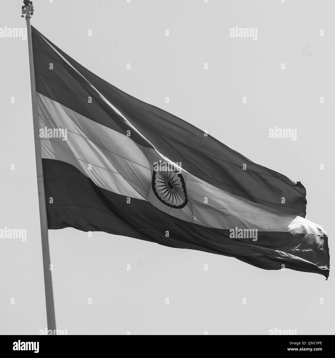 India flag flying at Connaught Place with pride in blue sky, India flag