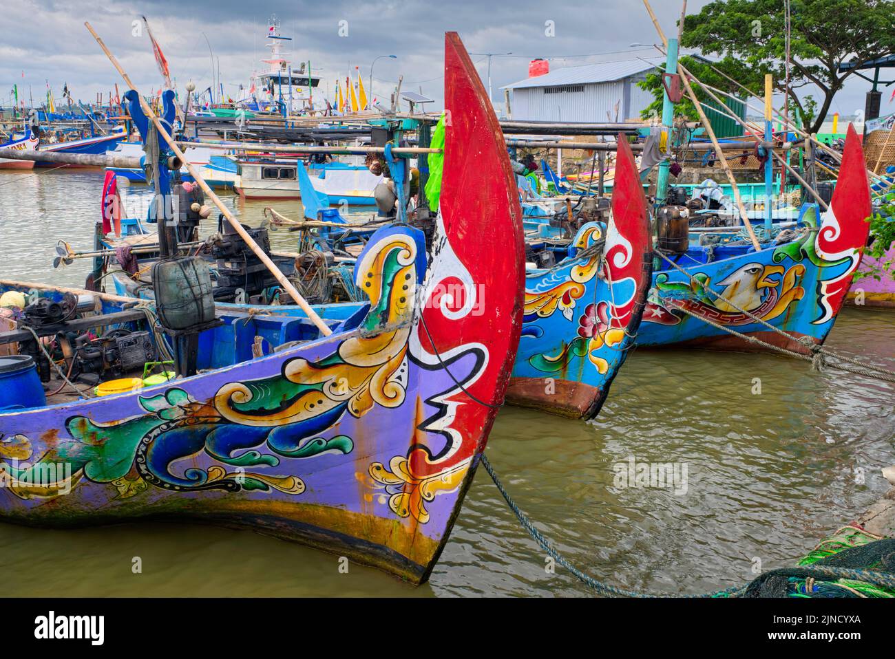 Almost all fishing boats are painted with colorful floral motifs on the front, while on the hull of the boat the name of the boat is written.  Taken @ Stock Photo
