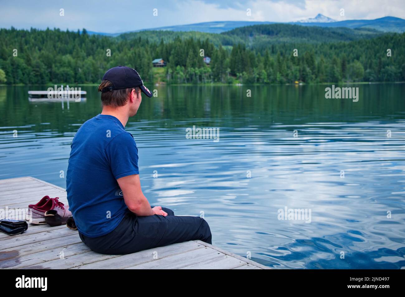 Man sitting on a bridge hi-res stock photography and images - Alamy