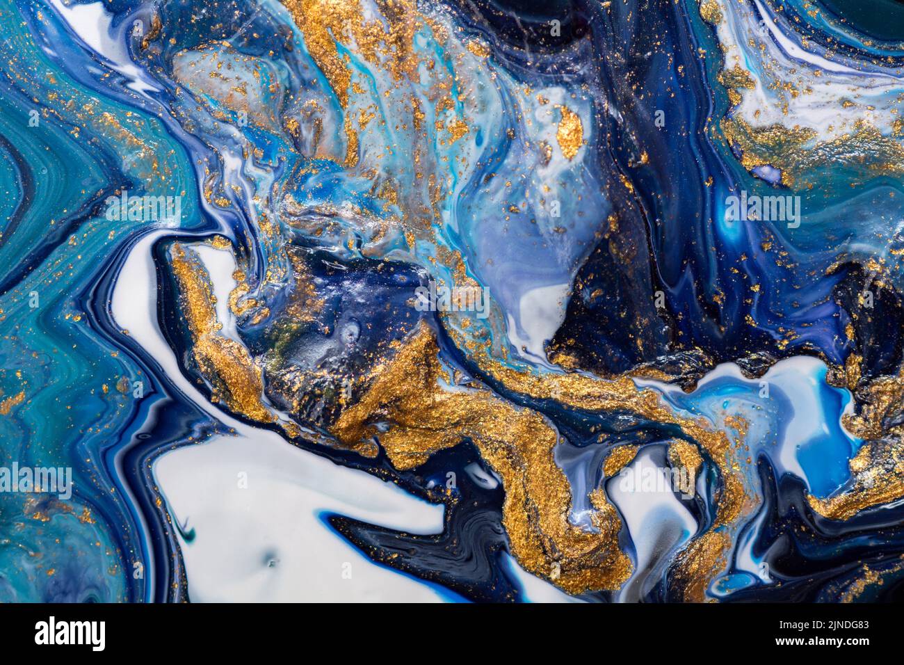 Luxury abstract fluid art painting background. Spilled blue, white and gold acrylic paint. Stock Photo