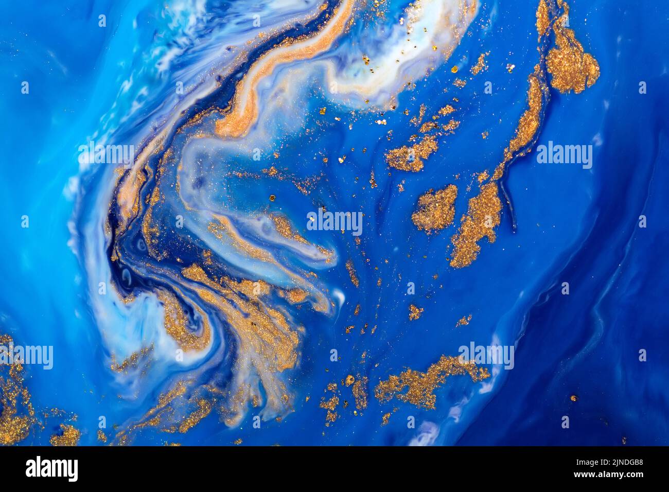 Luxury fluid art painting background. Spilled blue, white and gold acrylic paint. Liquid marble. Alcohol ink splash. Stock Photo