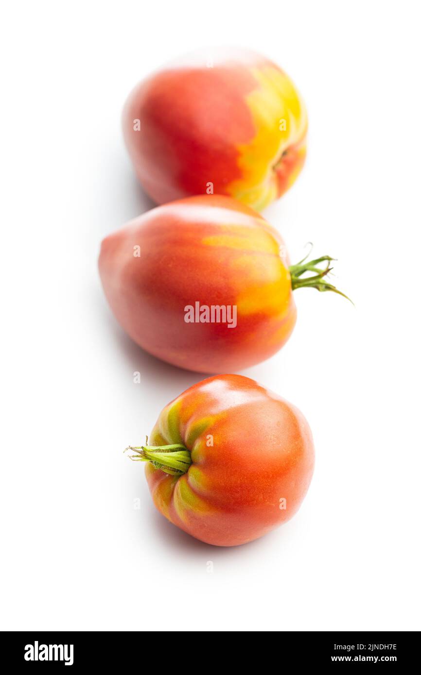 Bull heart tomatoes isolated on a white background. Stock Photo