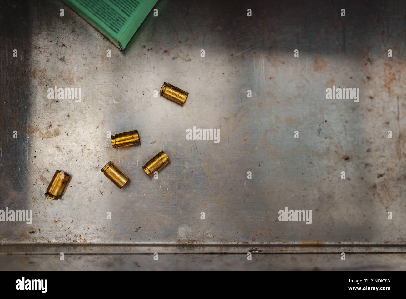Flat lay view of lying fired bullet casings. Stock Photo