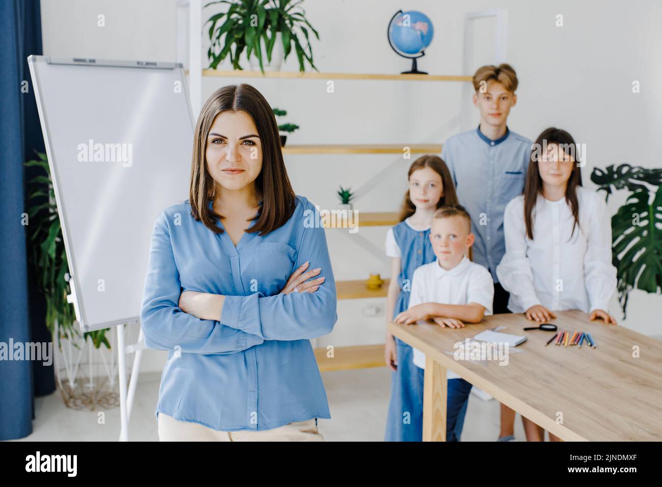 Smiling together. Group of children of different ages stand in a