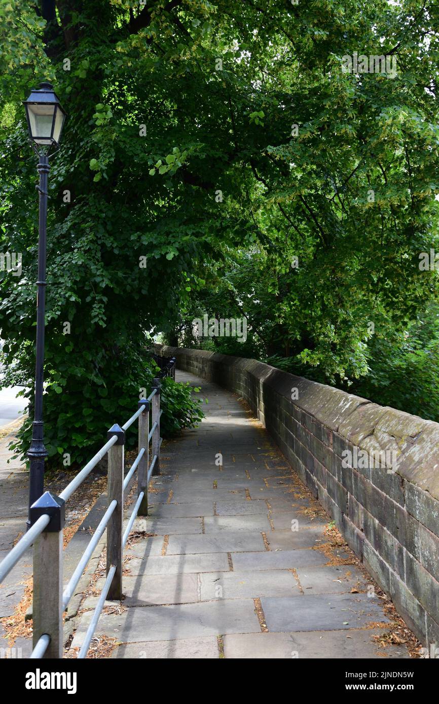 A footpath which follows the route of Chester City Walls Stock Photo