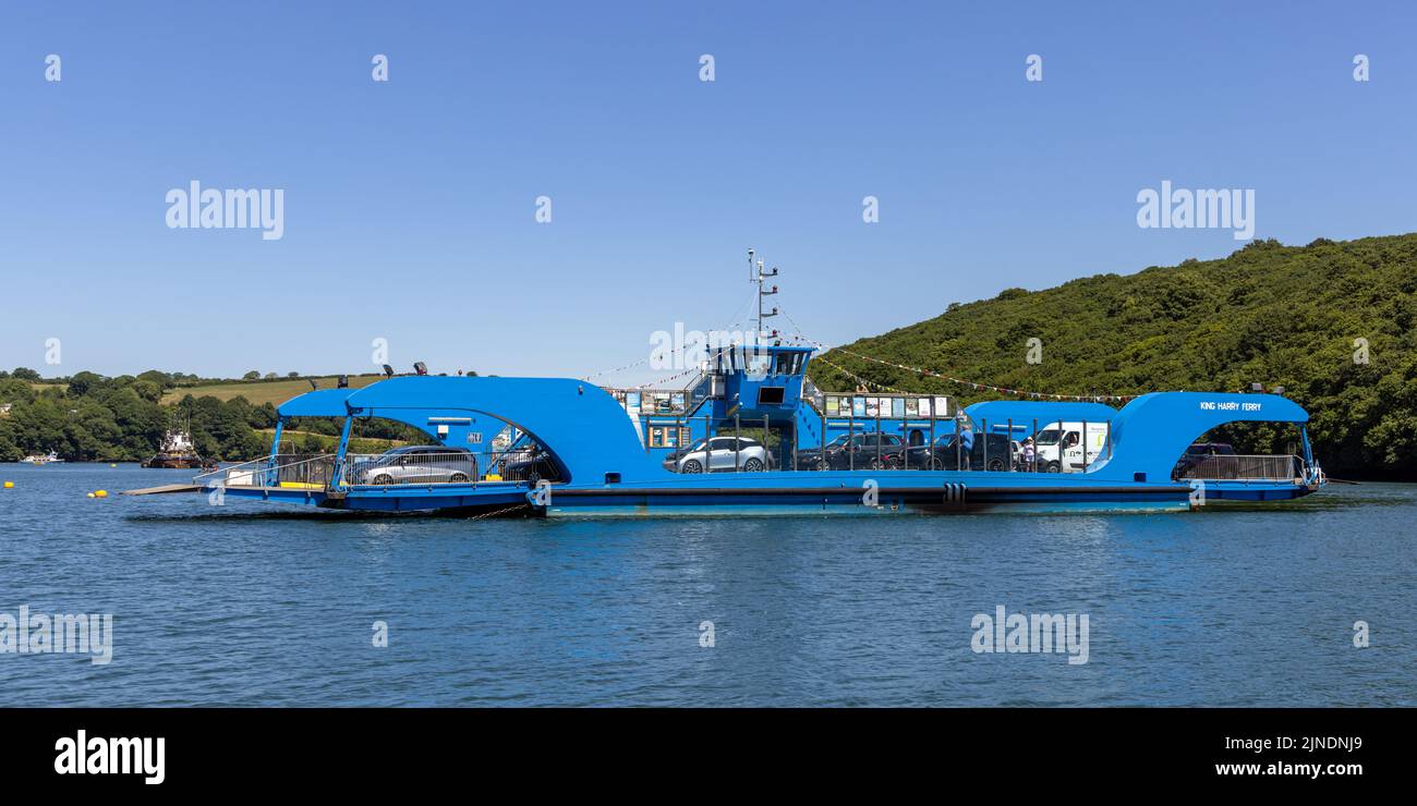 The fully loaded King Harry ferry crossing the river Fal in Cornwall on a summer day. Stock Photo