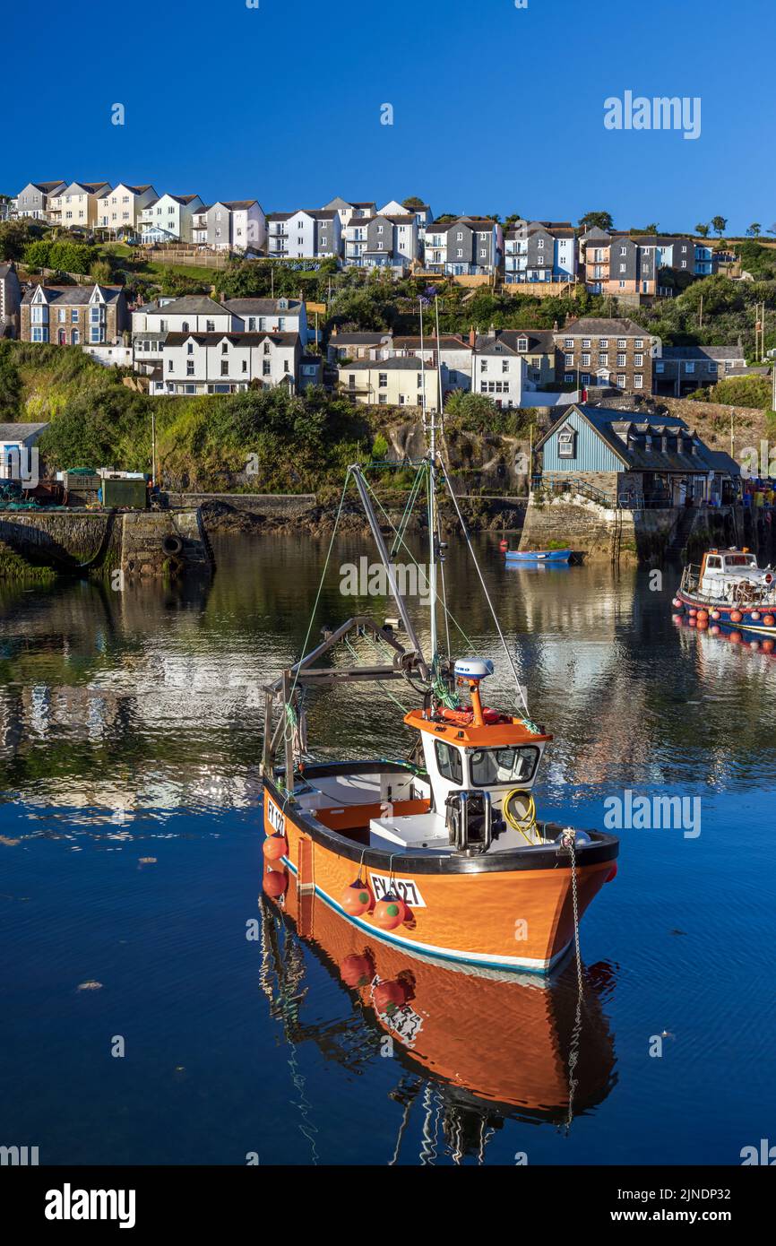 A colourful fishing boat moored in the inner harbour of the Cornish fishing village of Mevagissey. Stock Photo