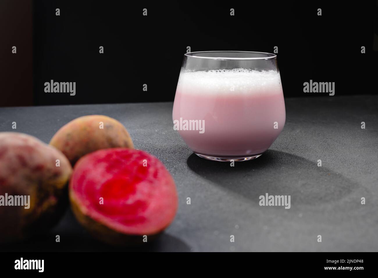 A cup with a beetbased drink. An alternative to coffee, giving up coffee. Beet Latte Stock
