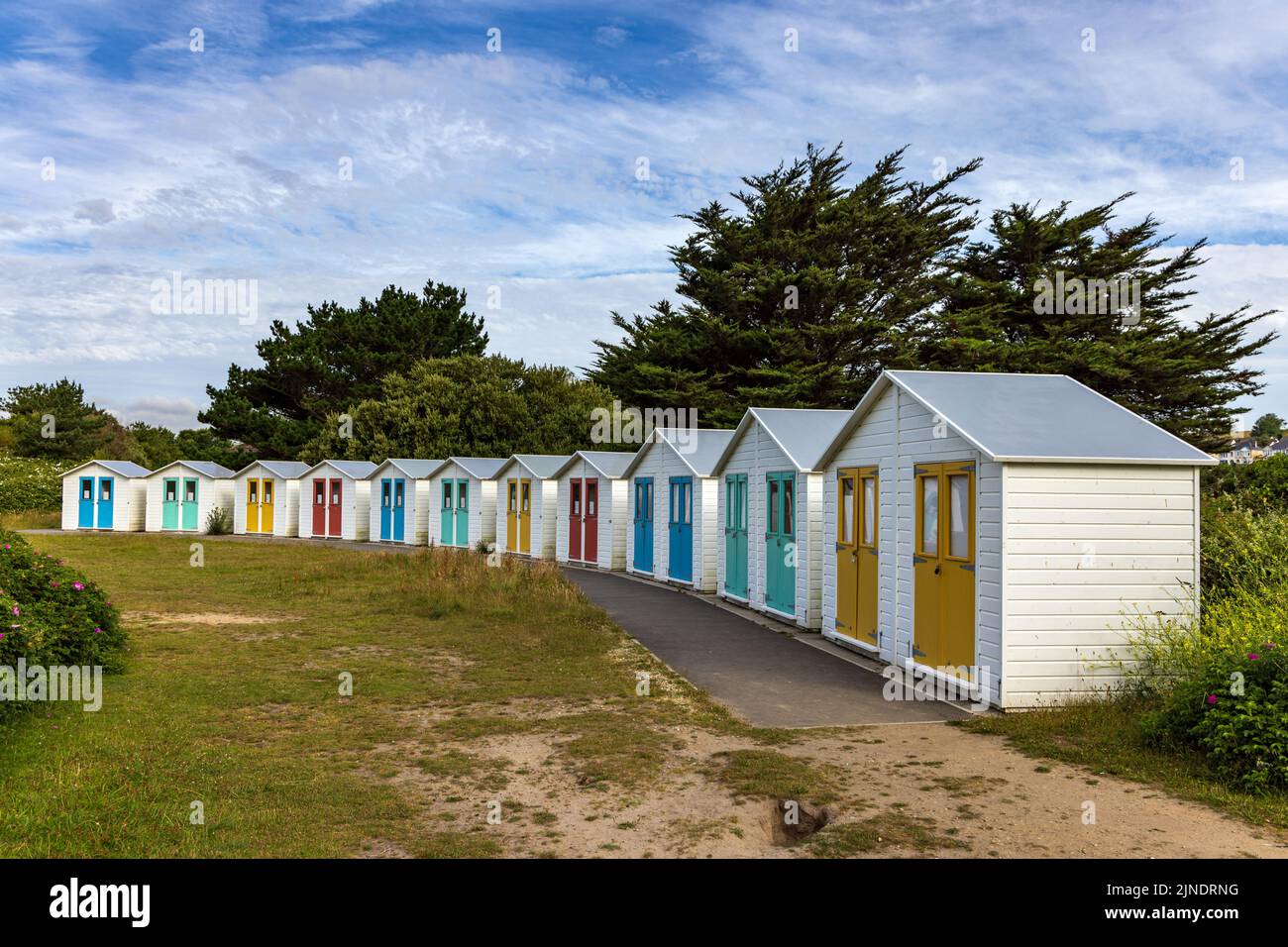 Row of colourful beach huts at Par Beach, Cornwall, England. Stock Photo