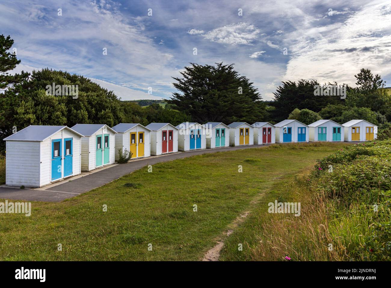 Row of colourful beach huts at Par Beach, Cornwall, England. Stock Photo