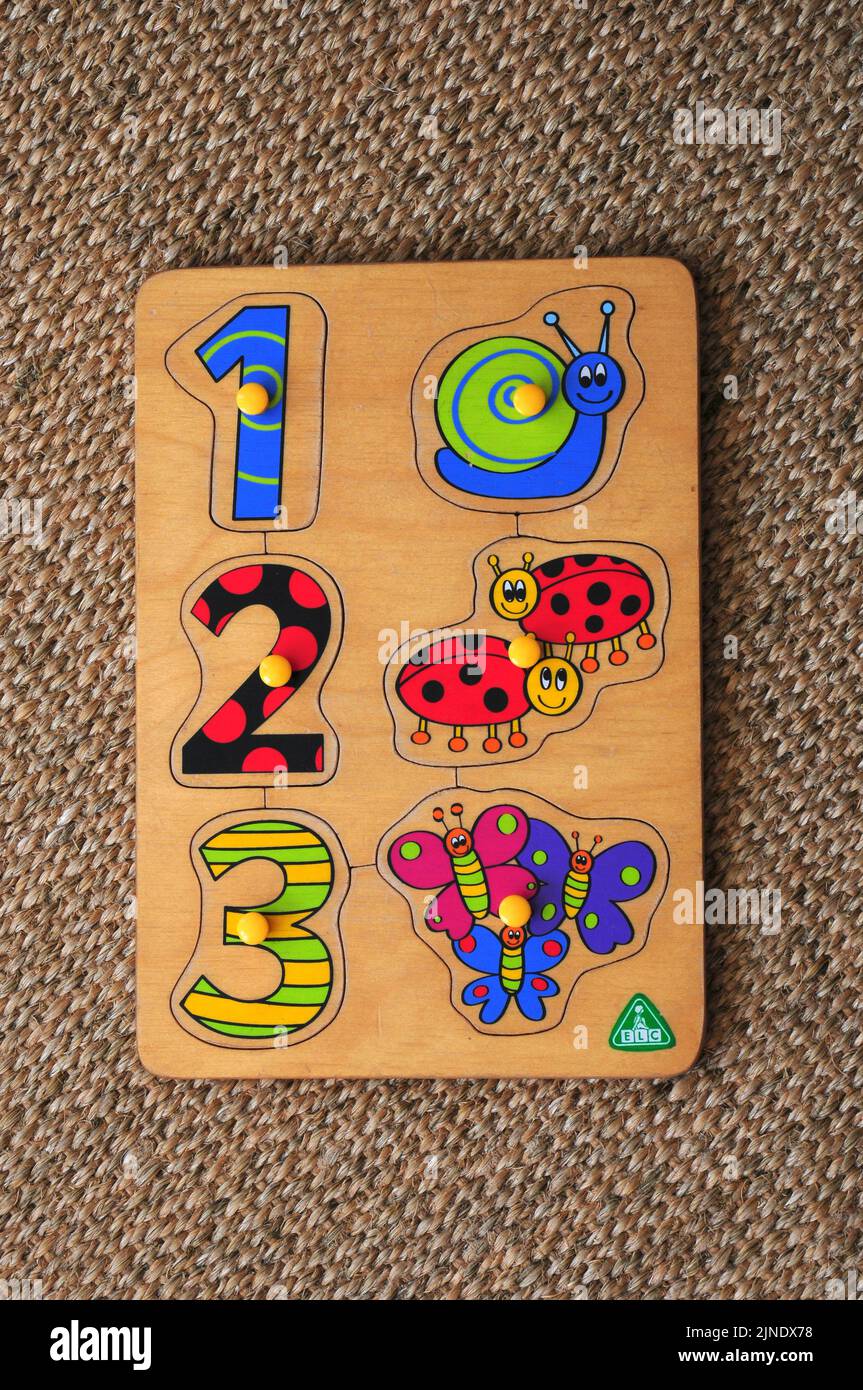 Children's numbers and shapes wooden puzzle for toddlers Stock Photo ...