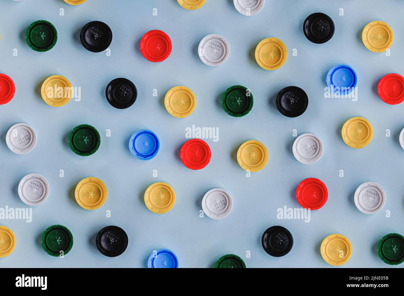 Plastic bottle caps background. Cap material is recyclable. Recycling