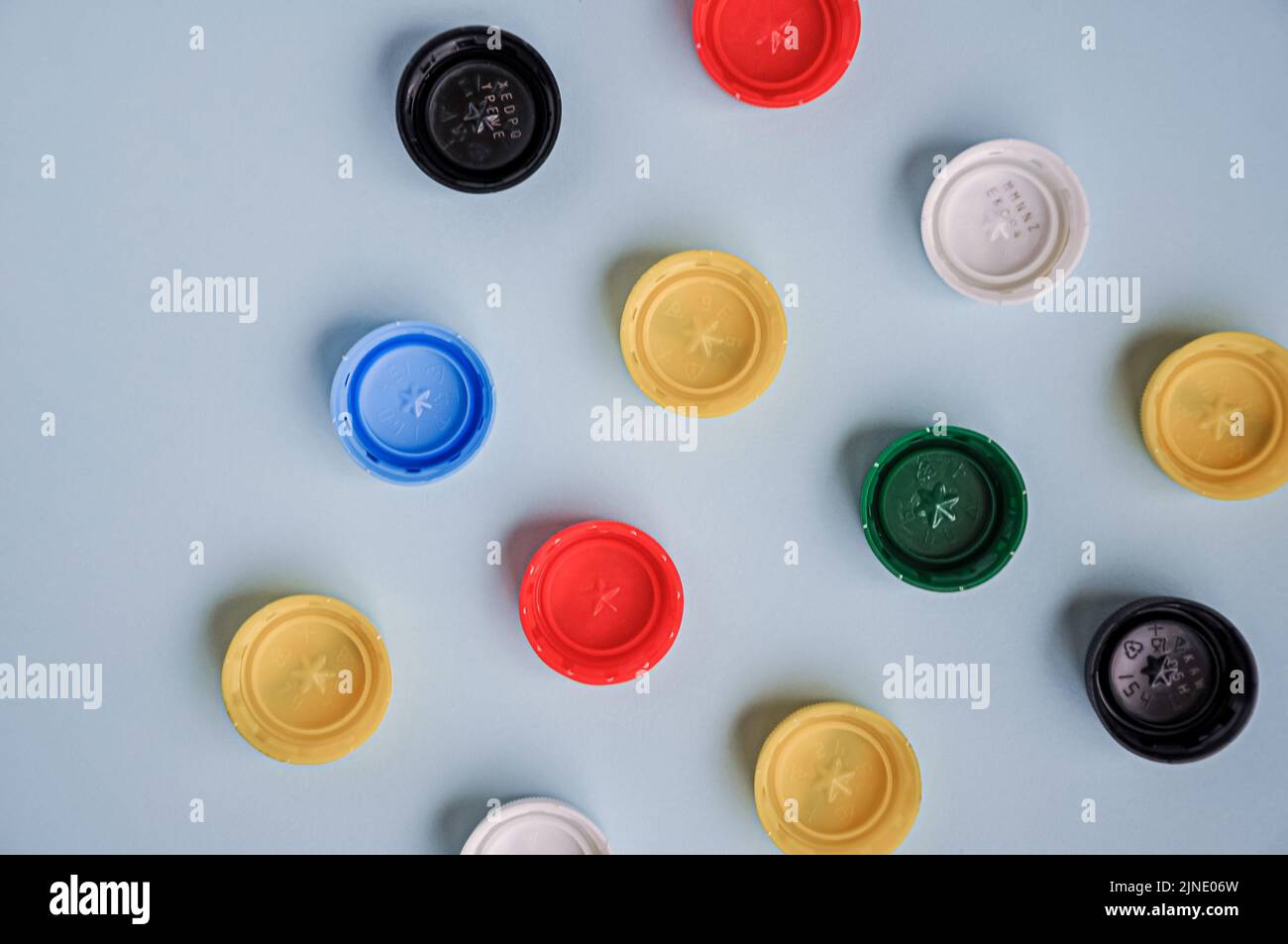 Plastic bottle caps background. Cap material is recyclable. Recycling