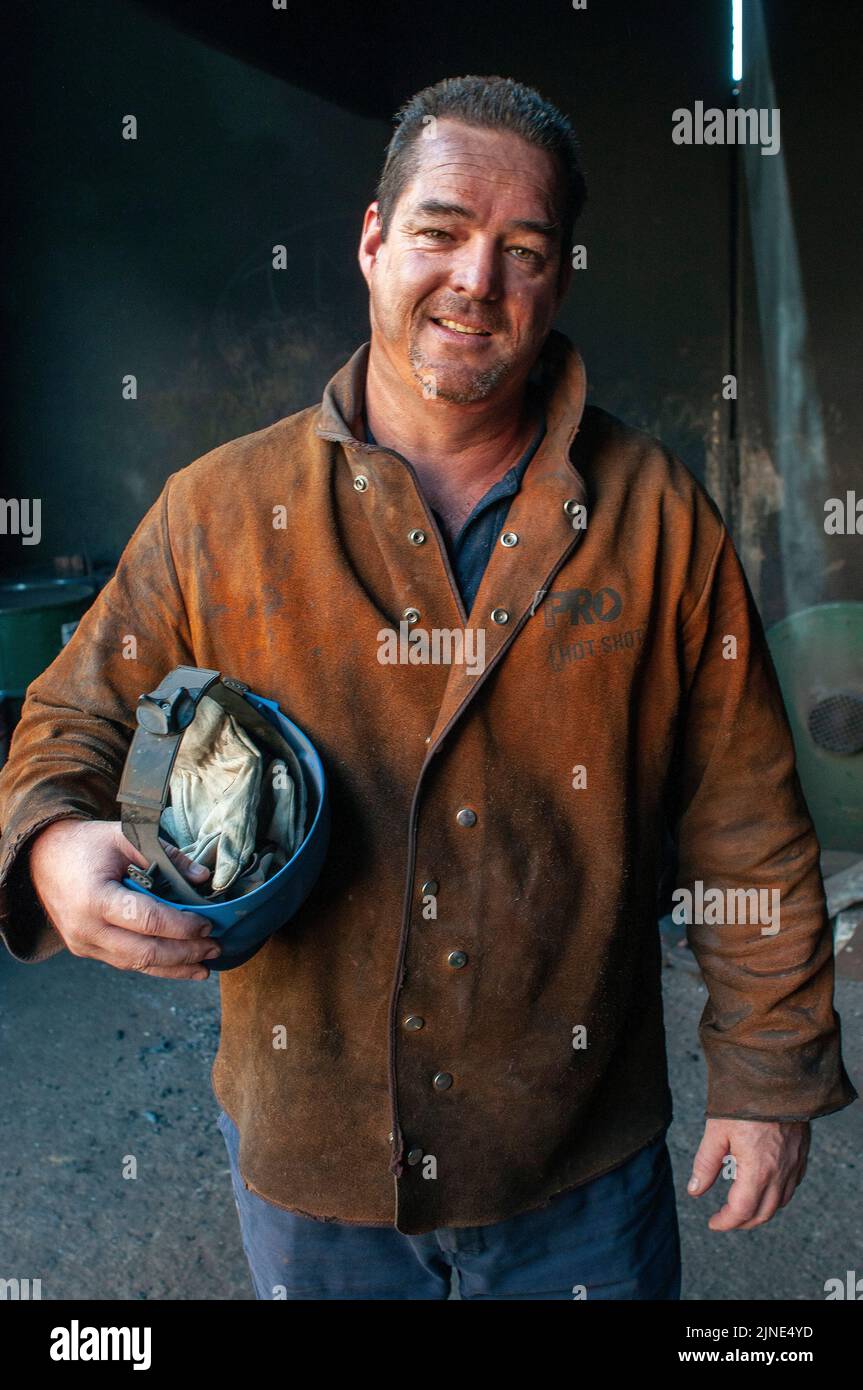 Foundry worker in a small family metal smelting foundry in Perth, Western Australia Stock Photo