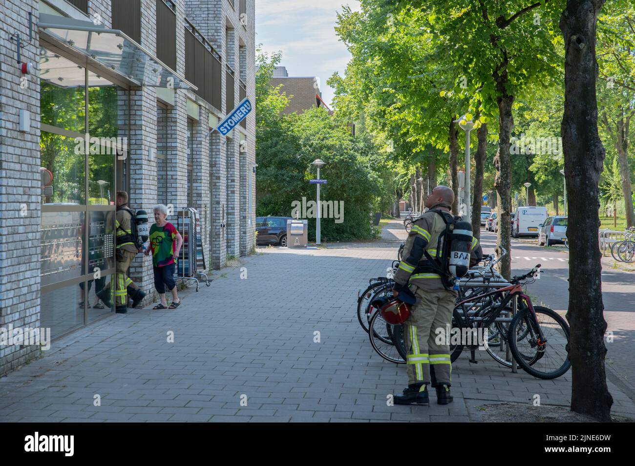 Fire Department Employees Going In A House At Amsterdam The Netherlands ...