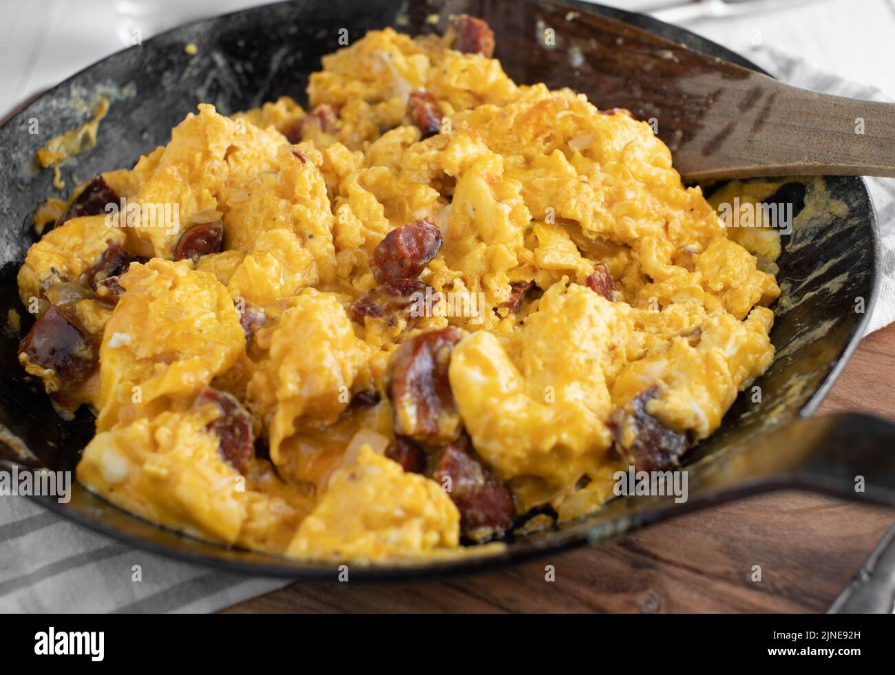 Chorizo with fried eggs in a pan Stock Photo