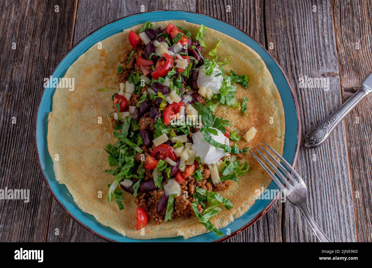 Open Pancake Open faced savory pancake with spicy ground beef, cheese, kidney beans ...