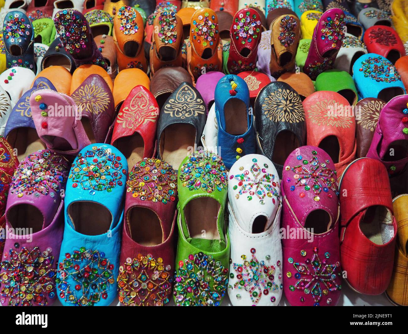 Handmade colourful babouche - leather slippers on display at traditional souk - street market in Morocco Stock Photo