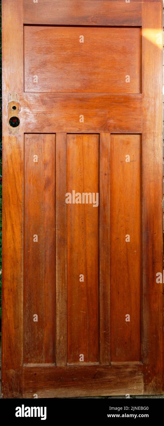 A renovation project has started on a wooden panel door. It has had it ...