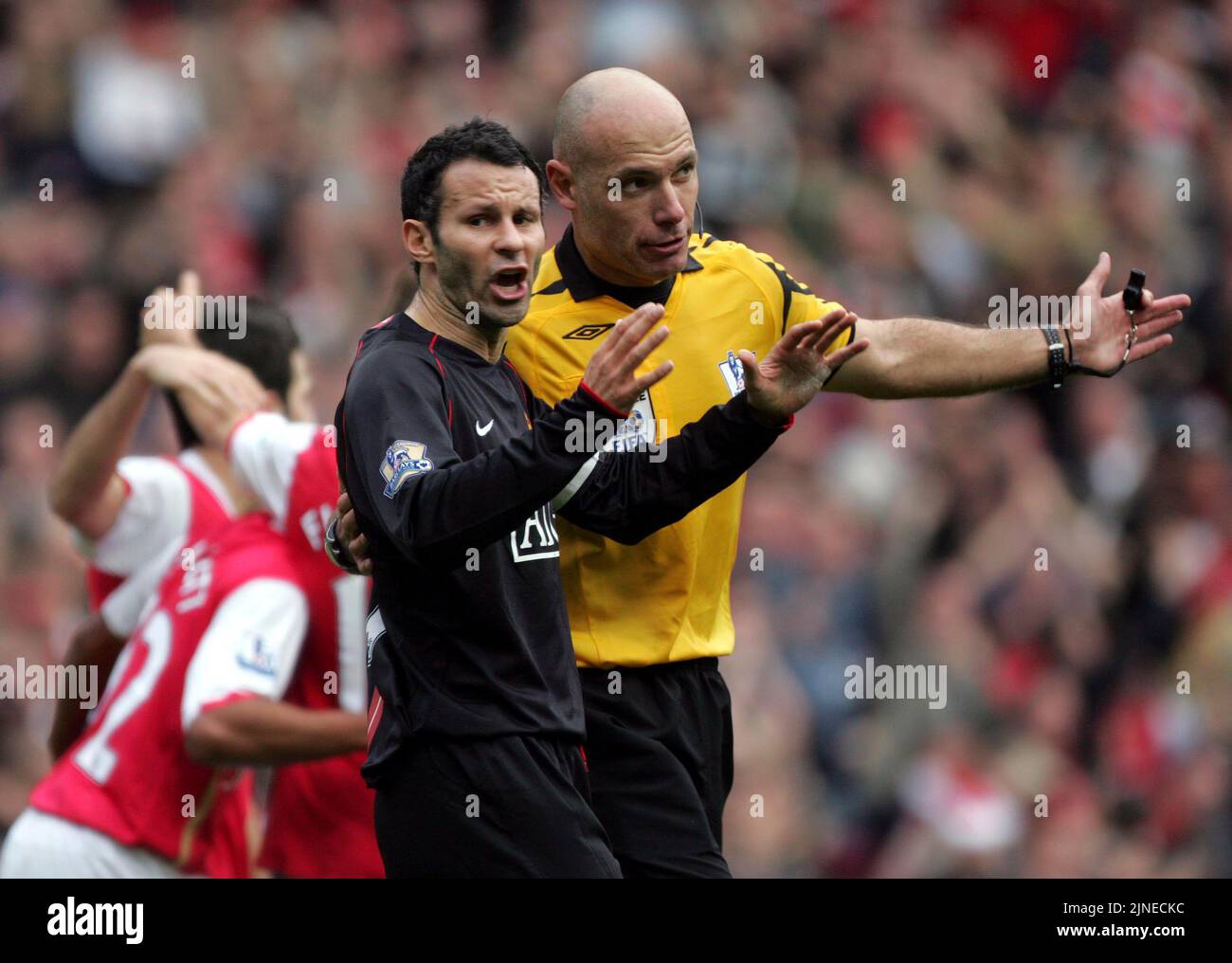 Arsenal v Man U  Howard Webb leads away Ryan Giggs after protests against equalizer     picture by Pixel8000 Ltd Stock Photo