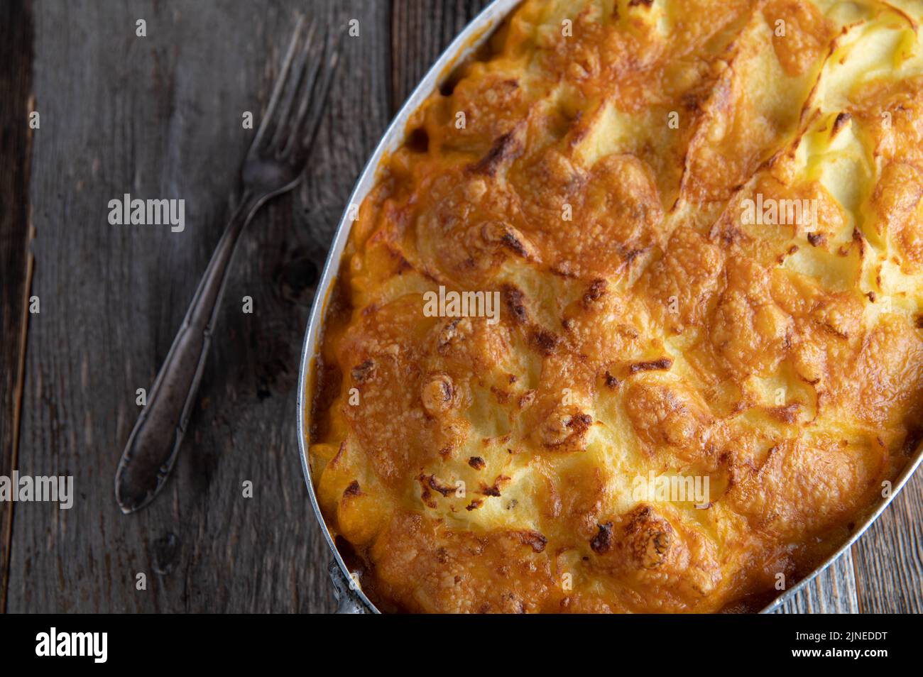Shepherds pie closed in a casserole dish with cheese potato crust Stock Photo